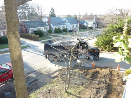 tri-axel truck arrives full of loam