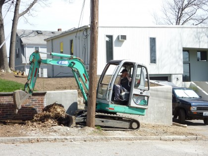 digging in front of the retaining wall