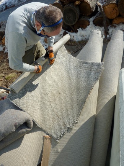 david rolls up the old carpet