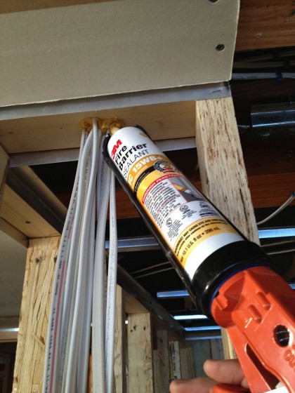 fire-rated caulk seals up the penetrations