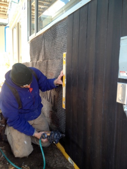 joe nails up the siding