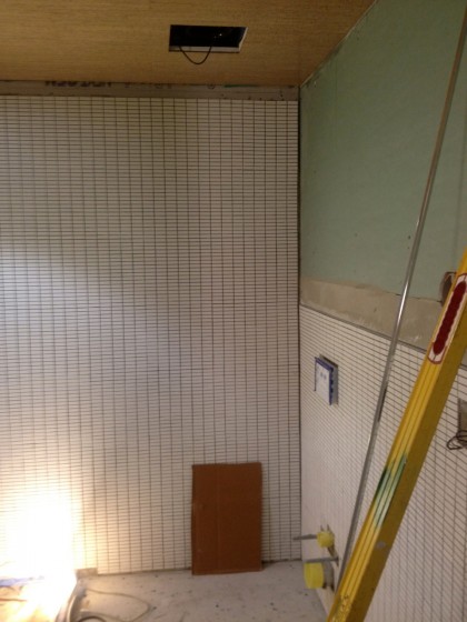 bath is tiled almost all the way to the ceiling now