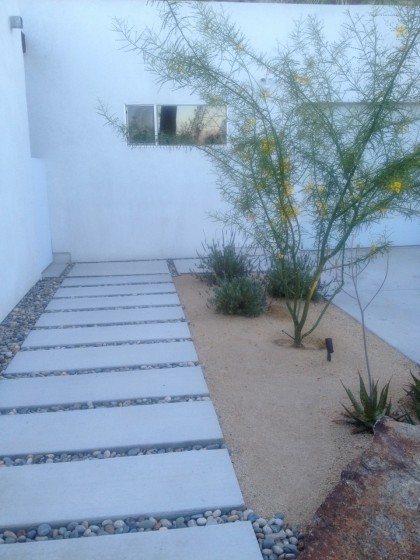 concrete walk alongside the driveway