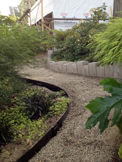 steel edging added here and there to hold the gravel