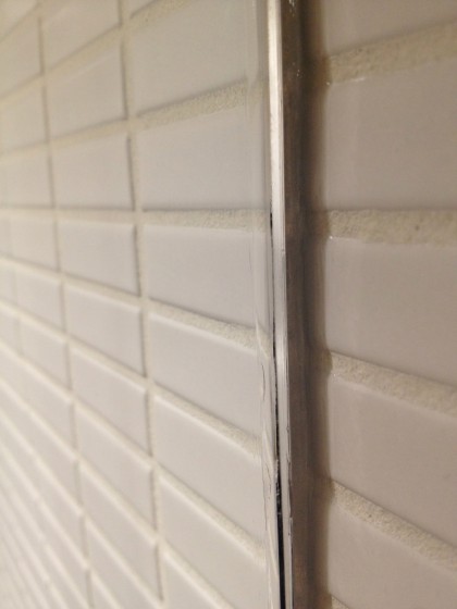 shower glass wall siliconed to the tile