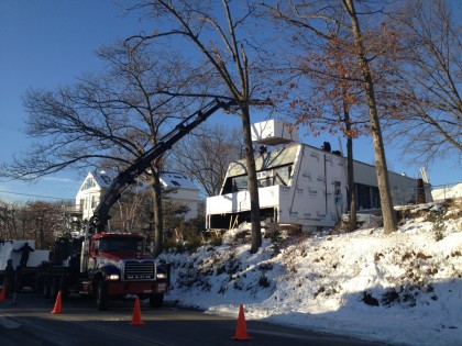 hoisting the EPS foam to insulate the roof.